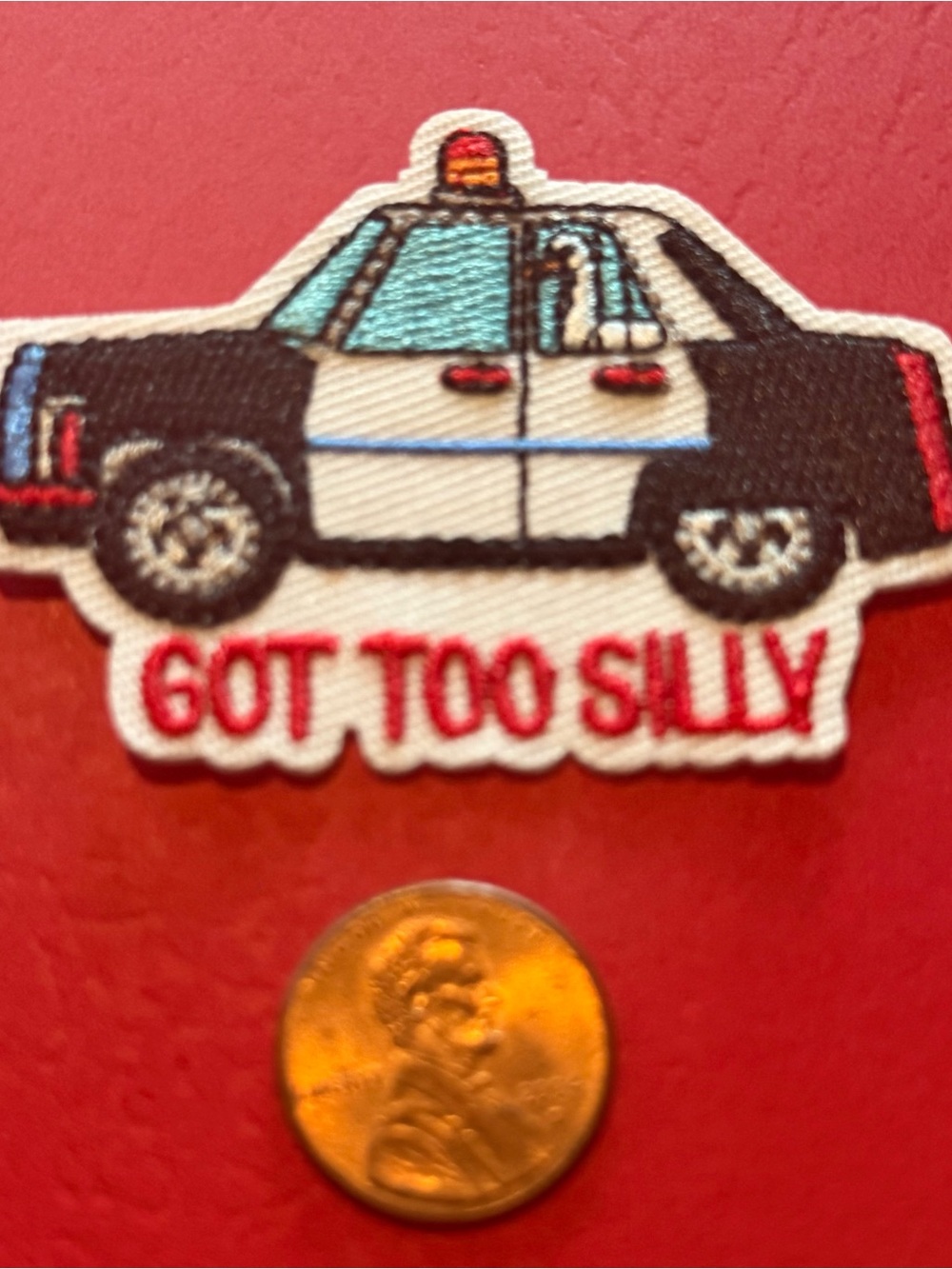 Black & White Police Car Iron-On Patch with Red Text